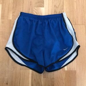 Blue, white, and black dry- fit Nike shorts